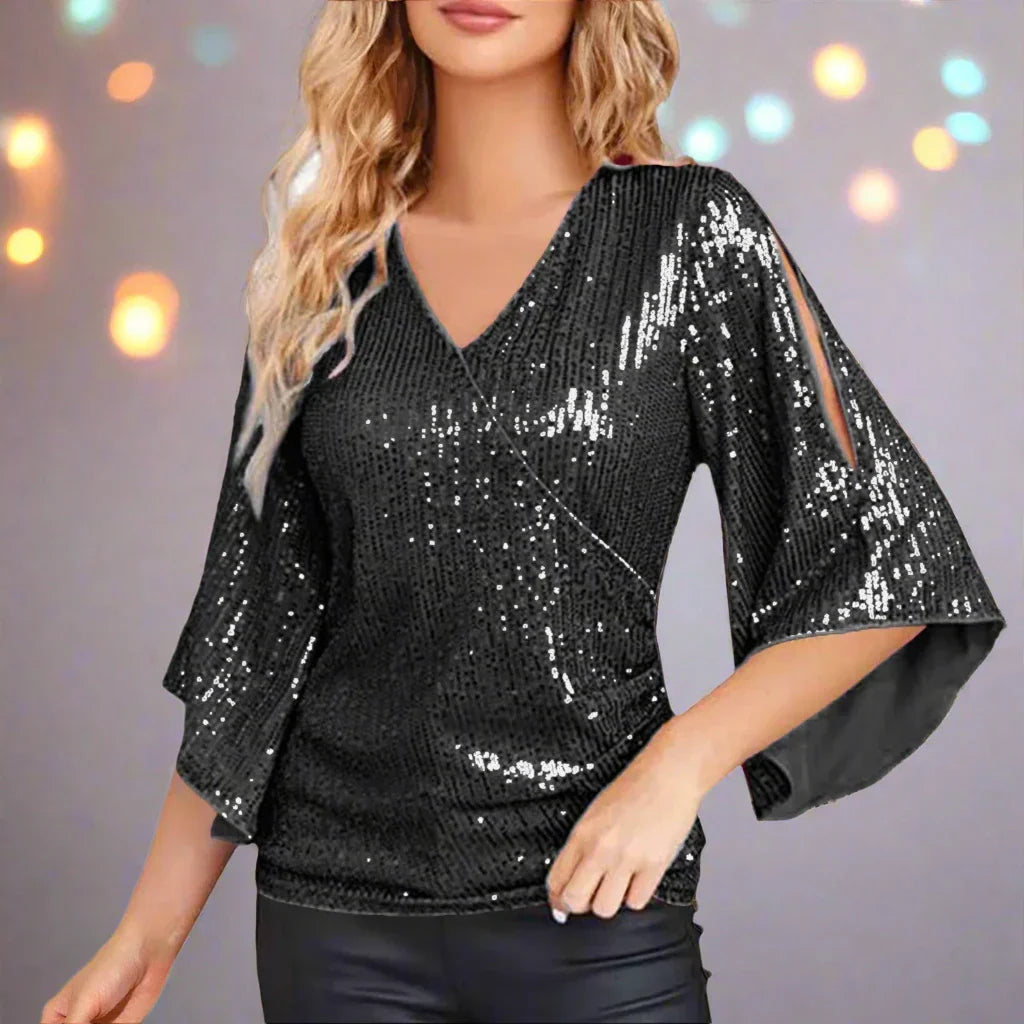 Céline | Glamourblus – Utsvängda ärmar och glittrande detaljer